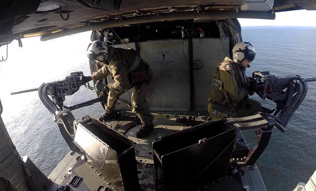 SOUTH CHINA SEA (Feb. 21, 2017) Naval Aircrewman (Helicopter) 1st Class Derik Richardson, right, and Naval Aircrewman (Helicopter) 2nd Class Kevin Brodwater, both attached to Helicopter Sea Combat Squadron (HSC) 23 embarked aboard the littoral combat ship USS Coronado (LCS 4), conduct a live-fire exercise aboard an MH-60S Sea Hawk helicopter. Coronado is a fast and agile warship tailor-made to patrol the region's littorals and work hull-to-hull with partner navies, providing U.S. 7th Fleet with the flexible capabilities it needs now and in the future.