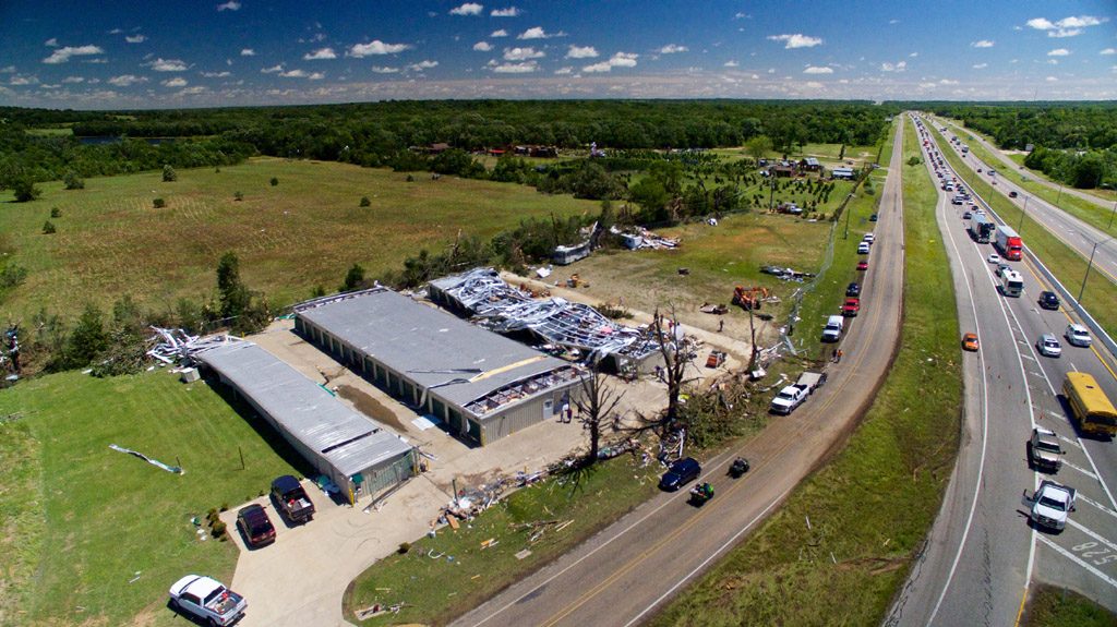 Traffic slows to a crawl on Interstate 20 as onlookers take notice of tornado damage on a business, in this picture taken from an unmanned aerial vehicle in Canton, Texas, April 30, 2017.